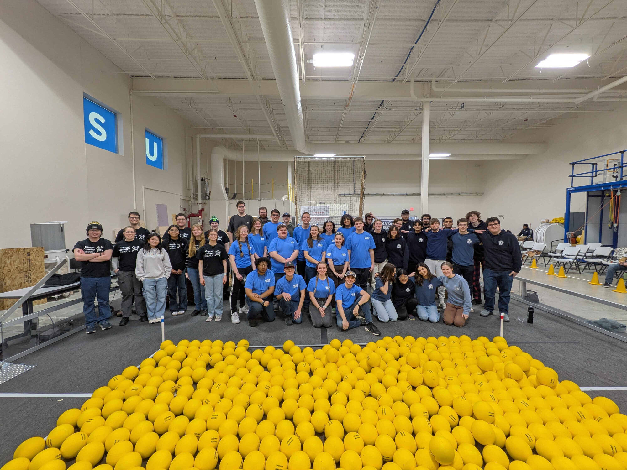 Ri3D teams pose for a group photo on the GVSU practice field